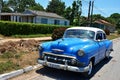 Old American car in Puerto Esperanza, Cuba Royalty Free Stock Photo