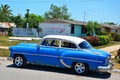 Old American car in Puerto Esperanza, Cuba Royalty Free Stock Photo