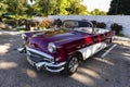 An old American classic Buick car is parked in a Parking lot in Havana