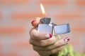 Old American retro lighter in the hand Royalty Free Stock Photo