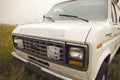 Old american ambulance van Ford Econoline at siberian fields