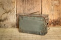 old ammunition box still life mat weave and wood board background Royalty Free Stock Photo