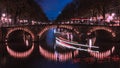 Old Amsterdam at night shot from one of the countless canal bridges Royalty Free Stock Photo