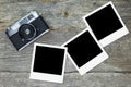 Old analog camera with blank photo frames Royalty Free Stock Photo