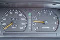 An old analog dashboard of a Japanese car. Speedometer up to 180 km and tachometer up to 8000 rpm Royalty Free Stock Photo