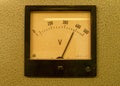 Old analog volt meter. Old measuring instrument with arrow and white scale Royalty Free Stock Photo