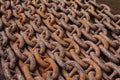 Old anchor chains, heavy, powerful, rusty, steel, lying in rows