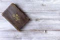 Old ancient antique catholic bible on wooden background with copy space