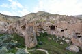 Antique city and residential caves in the mountainous red valley of Cappadocia