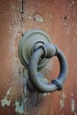 Old ancient door knocker on wooden door Royalty Free Stock Photo