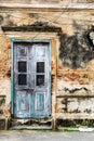 Old ancient door with old grunge brick wall Royalty Free Stock Photo