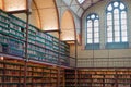 Old ancient library interior, ceiling books, windows, bookshelf