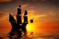 Old ancient pirate ship on peaceful ocean at sunset. Royalty Free Stock Photo