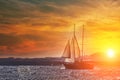 Old ancient ship on peaceful ocean at sunset. Calm waves reflection, sun setting. Copy space Royalty Free Stock Photo