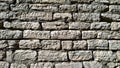 Old ancient stone abandoned wall background. Brick Texture backdrop. Copy space. Building facade renovation. Restoration and Royalty Free Stock Photo