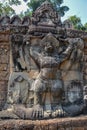 Old ancient stone carving statue of hindu, buddha god symbol in angkor wat temple, cambodia Royalty Free Stock Photo