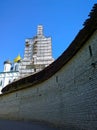 Old ancient stone wall of Kremlin Pskov, Russia. Trinity cathedral. Bell tower renovation, scaffolding. Restoration of ancient Royalty Free Stock Photo