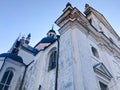 Old ancient white poor stone shabby Christian Orthodox church with crosses Royalty Free Stock Photo