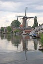 Old ancient windmill along river Old Rhine in city of Bodegraven whch became beer brewery