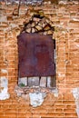 Old ancient window with grunge brick wall Royalty Free Stock Photo