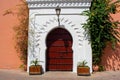 Old ancient wooden arch doors in Marrakech morocco. African Islamic architecture in North Africa Royalty Free Stock Photo