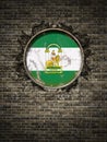 Old Andalucia flag in brick wall Royalty Free Stock Photo