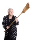 Old angry woman threatening with a broom Royalty Free Stock Photo