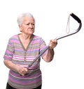 Old angry woman threatening with a cane Royalty Free Stock Photo