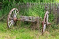 Old Animal Drawn Cart. Decorative old wheels from a rural cart. Old wooden cart inside a country garden