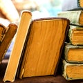 Old antiquarian books stand horizontally in a row. Front view. S Royalty Free Stock Photo