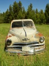 OLD ANTIQUE ABANDONED PLYMOUTH TRUCK IN FOREST IN IDAHO