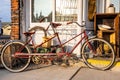 An old antique bicycle built for two in front of a country Royalty Free Stock Photo