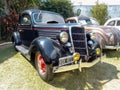 Old antique black 1935 Ford V8 coupe five window model 48 in a park. CADEAA 2023 classic car show Royalty Free Stock Photo