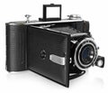 Old, antique, black, pocket camera. Front view for the lens. Royalty Free Stock Photo