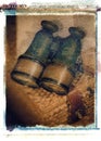Old antique vintage binoculars field glasses on wicker basket Royalty Free Stock Photo