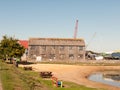 Old antique brown faded wooden boat house tollesbury maldon