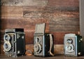 old antique camera the collection is placed on wooden shelf Royalty Free Stock Photo