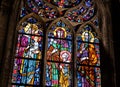 Old antique colorful stained glass windows in a church, saints, indoors religious decoration detail, closeup, nobody. Christianity