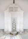 Old antique fountain of marble, decorated with ornaments and paintings