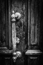 Old Antique Handle On Wooden Entrance Door. Handle On Wooden Door. Black And White Background. Royalty Free Stock Photo