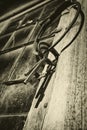 Old antique keys and ring against leaded window Royalty Free Stock Photo