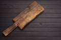 Old antique kitchen utensils chopping board placed on the old black wooden floor top view Royalty Free Stock Photo