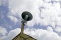 Old antique loudspeaker on the roof Royalty Free Stock Photo
