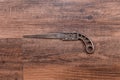 Antique miniature metal saw on a hardwood workbench - center