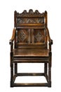 Old antique oak wainscot chair with carving isolated on white