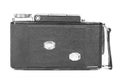 Old, antique pocket camera. The black camera is covered with a black leather handle. Front view on a white background Royalty Free Stock Photo