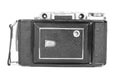 Old, antique pocket camera. The black camera is covered with a black leather handle. Front view on a white background Royalty Free Stock Photo