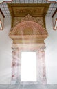 Old antique portal, and a door with pillars with frescoes and sun Royalty Free Stock Photo