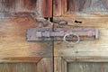 old antique rusty latch on a wooden door Royalty Free Stock Photo