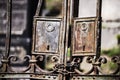 Old rusty metal fence bars with two keyholes tied by rusty chain Royalty Free Stock Photo